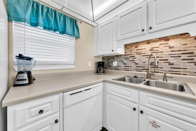 kitchen with decorative backsplash, dishwasher, white cabinets, and sink