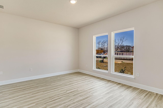 unfurnished room featuring light hardwood / wood-style floors