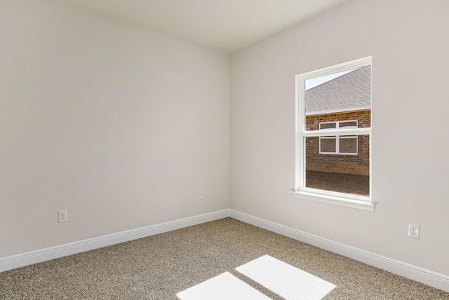 carpeted empty room featuring plenty of natural light