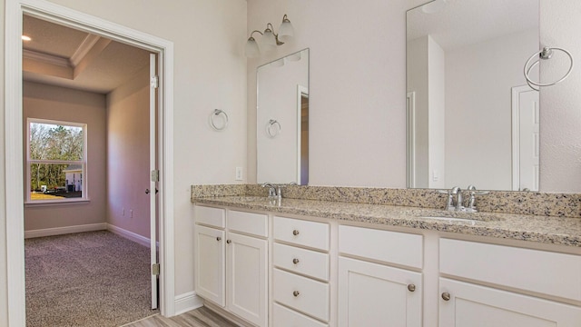 bathroom with vanity and ornamental molding