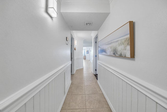 376 Santa Rosa Boulevard Unit 112 - 2Nd Floor, Fort Walton Beach, FL 32548 - hallway with light tile patterned floors and a textured ceiling