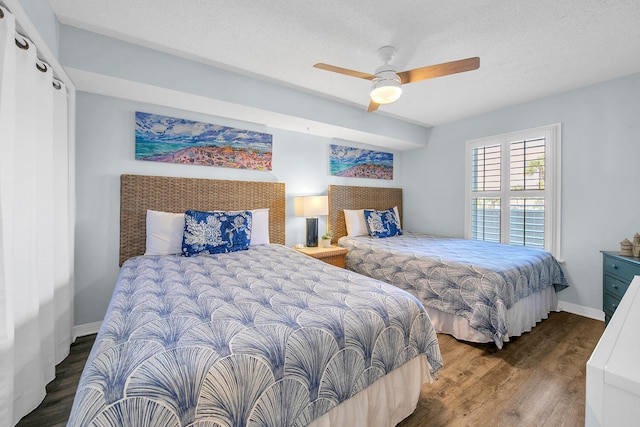 376 Santa Rosa Boulevard Unit 112 - 2Nd Floor, Fort Walton Beach, FL 32548 - bedroom featuring ceiling fan, dark hardwood / wood-style floors, and a textured ceiling