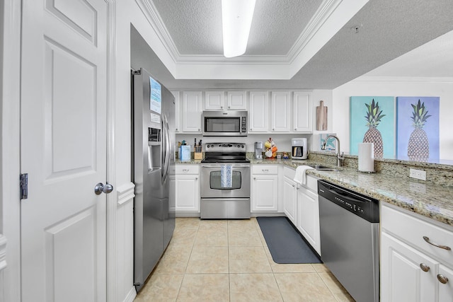376 Santa Rosa Boulevard Unit 112 - 2Nd Floor, Fort Walton Beach, FL 32548 - kitchen featuring white cabinets, crown molding, sink, light tile patterned flooring, and stainless steel appliances