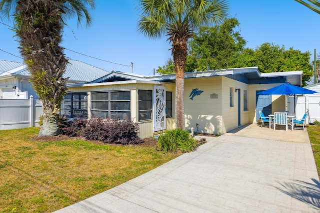 view of front of property with a front lawn