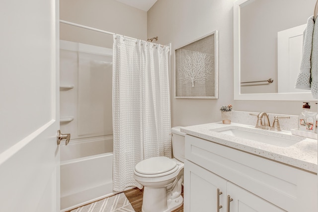 full bathroom with toilet, wood-type flooring, vanity, and shower / tub combo with curtain