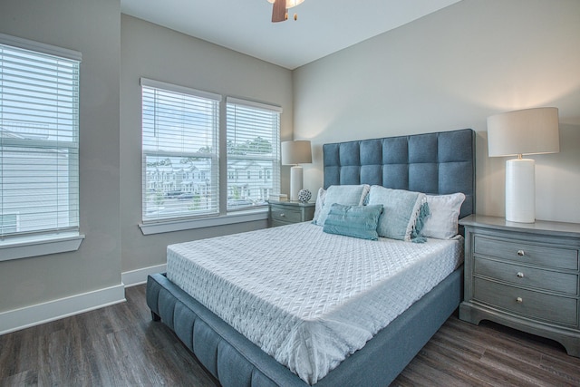 bedroom featuring ceiling fan and dark wood-type flooring