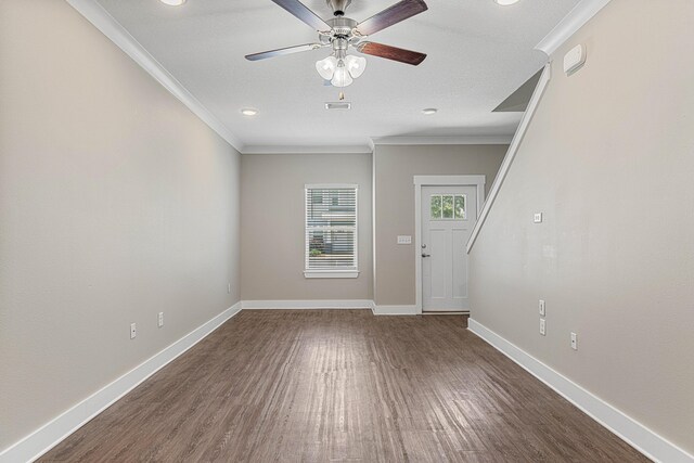 182 N Sand Palm Rd, Freeport, FL 32439 - foyer entrance featuring crown molding, baseboards, dark wood-style floors, ceiling fan, and recessed lighting