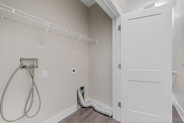 182 N Sand Palm Rd, Freeport, FL 32439 - washroom with dark wood-style floors, washer hookup, electric dryer hookup, and baseboards