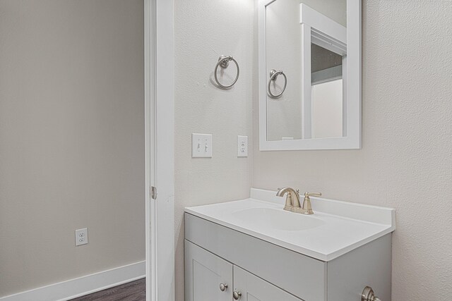 182 N Sand Palm Rd, Freeport, FL 32439 - bathroom featuring vanity and wood finished floors