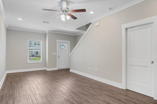 182 N Sand Palm Rd, Freeport, FL 32439 - foyer entrance with wood finished floors, ornamental molding, a ceiling fan, baseboards, and a textured ceiling
