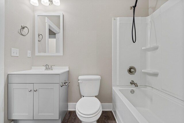 182 N Sand Palm Rd, Freeport, FL 32439 - full bathroom featuring vanity, toilet, bathing tub / shower combination, baseboards, and wood finished floors