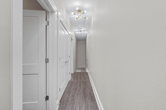 182 N Sand Palm Rd, Freeport, FL 32439 - hallway with dark wood-style flooring, attic access, and baseboards