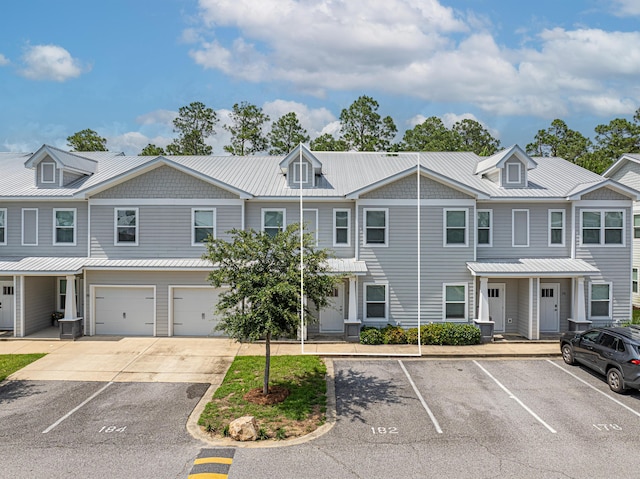 182 N Sand Palm Rd, Freeport, FL 32439 - townhome / multi-family property with metal roof, uncovered parking, and a standing seam roof