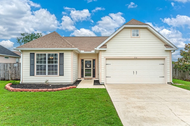 view of front of house with a garage and a front lawn