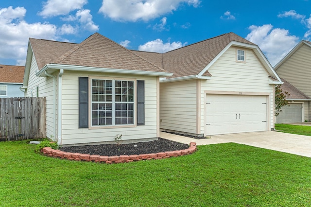 view of front of home featuring a front lawn and a garage