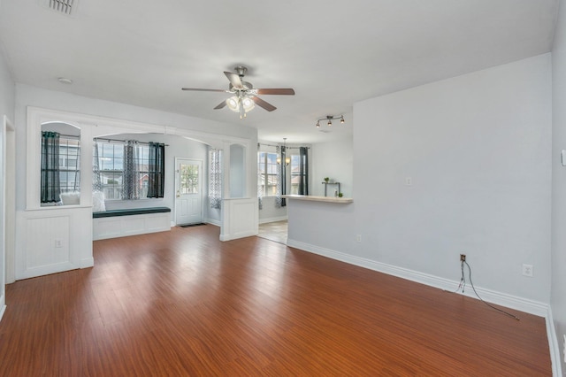 unfurnished room with hardwood / wood-style flooring and ceiling fan