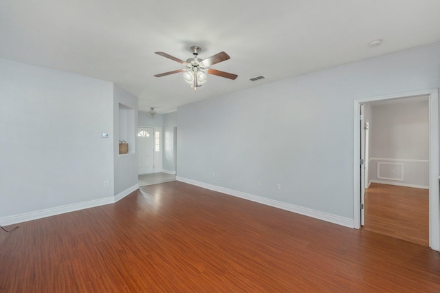 unfurnished room with ceiling fan and hardwood / wood-style floors