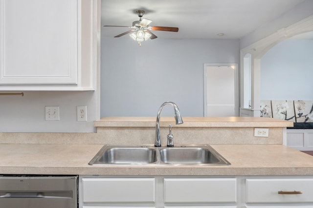 kitchen featuring white cabinets, ceiling fan, stainless steel dishwasher, and sink