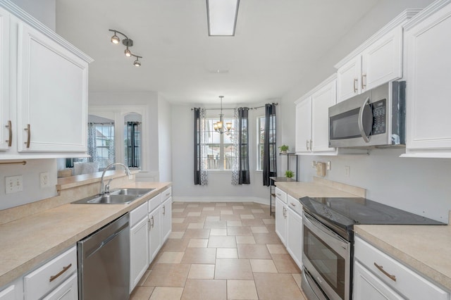 kitchen featuring white cabinetry, sink, and stainless steel appliances