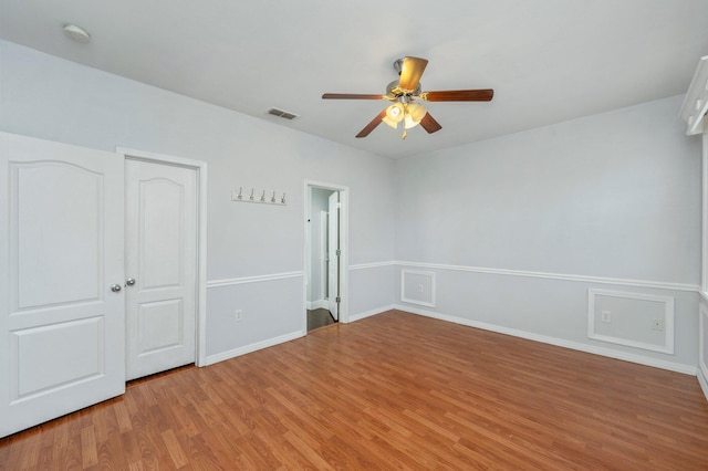 unfurnished bedroom featuring wood-type flooring and ceiling fan