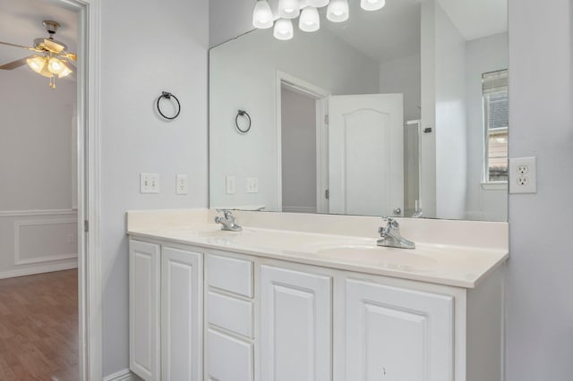 bathroom featuring ceiling fan, vanity, and hardwood / wood-style flooring