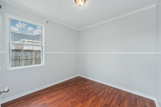 unfurnished room with crown molding and dark wood-type flooring