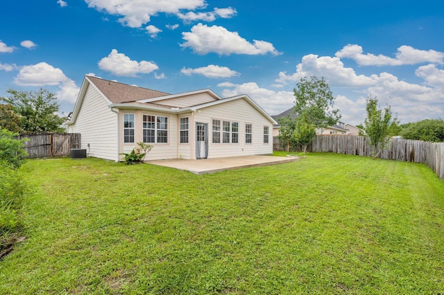 back of property featuring a patio, central air condition unit, and a lawn