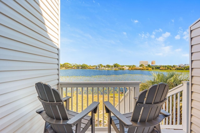 wooden deck featuring a water view