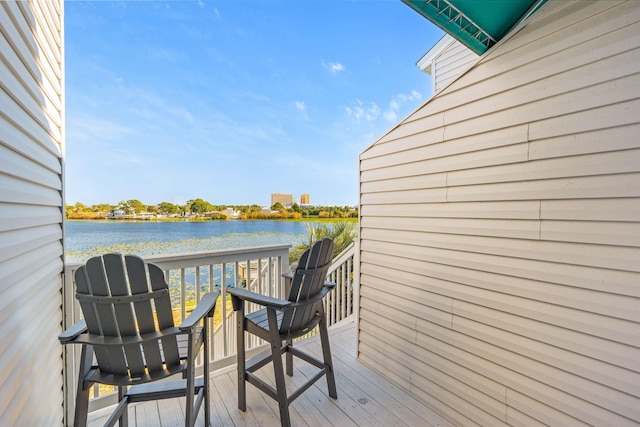 balcony featuring a water view