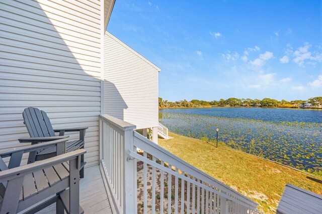 wooden terrace with a water view