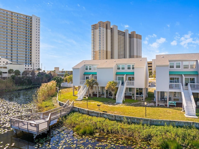 exterior space featuring a yard and a water view