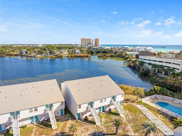 birds eye view of property with a water view