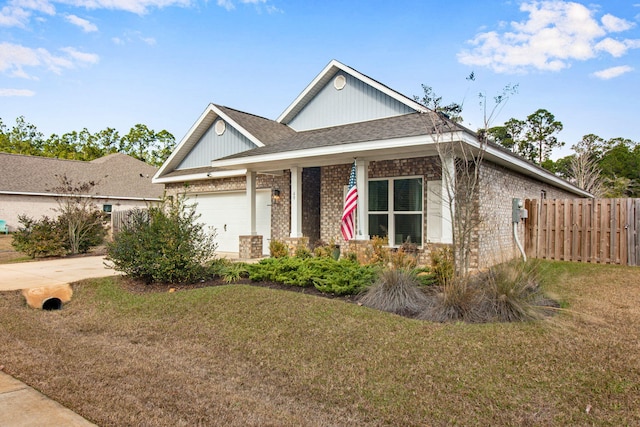 view of front of home featuring a garage and a front yard