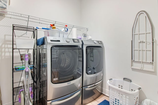 washroom featuring independent washer and dryer