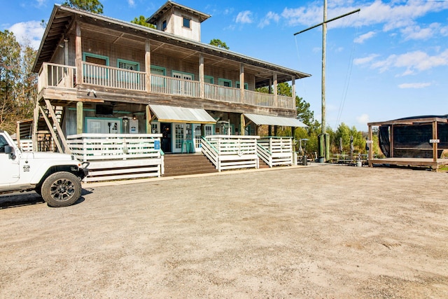 view of front of home featuring a balcony