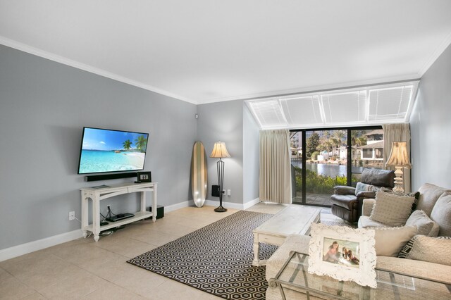 living room with light tile patterned floors and crown molding