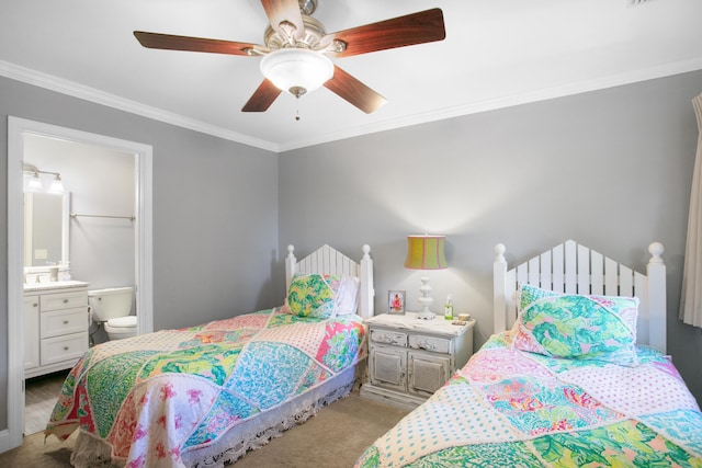 bedroom featuring ceiling fan, light colored carpet, ornamental molding, and connected bathroom