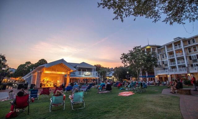 surrounding community with a lawn