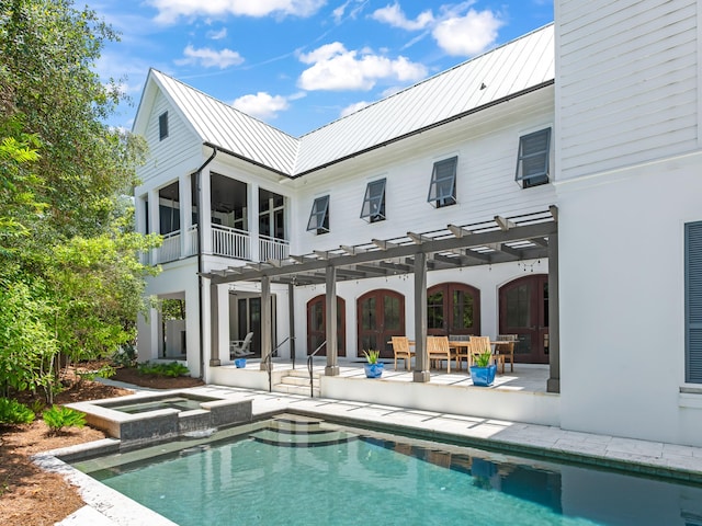 107 E Bermuda Dr, Santa Rosa Beach, FL 32459 - rear view of house featuring a pergola, a standing seam roof, a metal roof, and a patio area