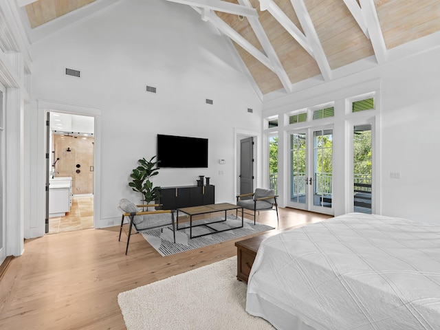 107 E Bermuda Dr, Santa Rosa Beach, FL 32459 - bedroom with high vaulted ceiling, access to outside, french doors, light wood finished floors, and beam ceiling