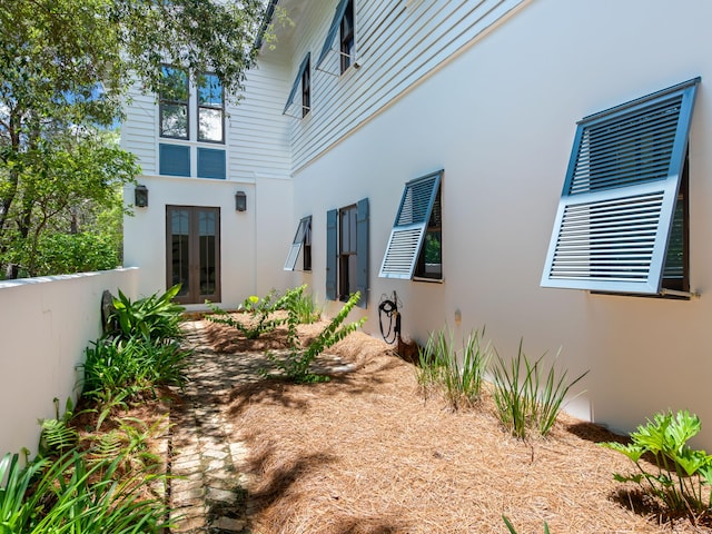 107 E Bermuda Dr, Santa Rosa Beach, FL 32459 - back of house with french doors and stucco siding