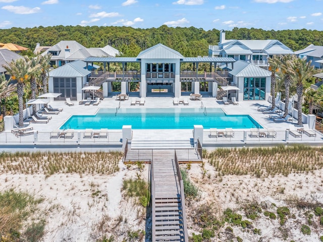 107 E Bermuda Dr, Santa Rosa Beach, FL 32459 - community pool featuring a patio area and a wooded view