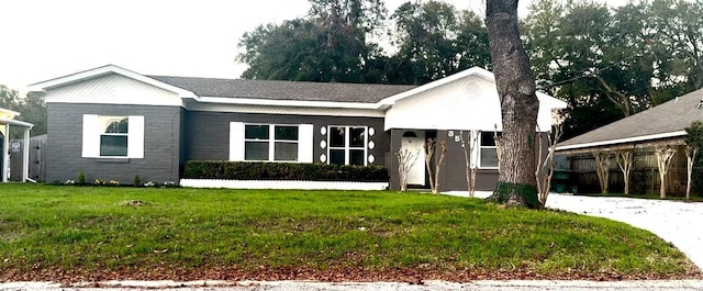 ranch-style house with a front yard