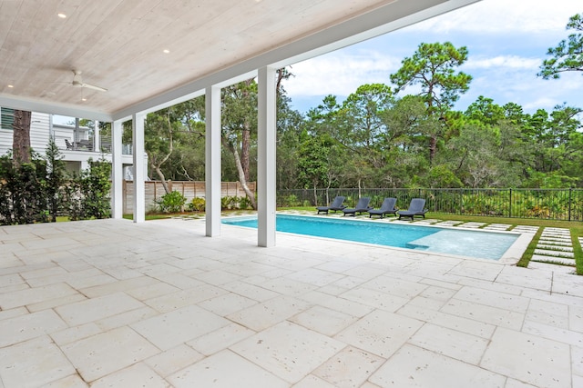 view of swimming pool with ceiling fan, a patio, a fenced backyard, and a fenced in pool