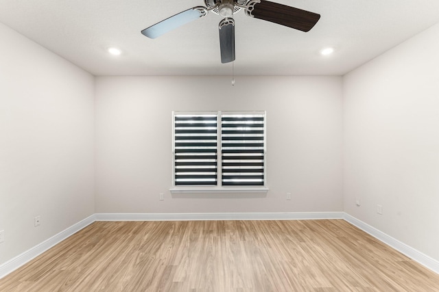 spare room with ceiling fan and light hardwood / wood-style flooring