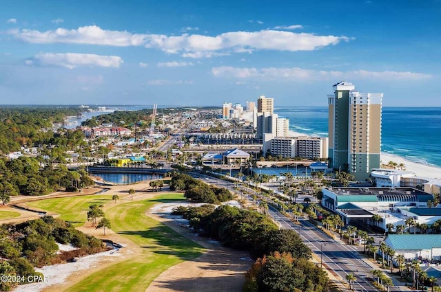 birds eye view of property with a beach view and a water view