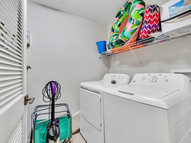 laundry area with washing machine and dryer