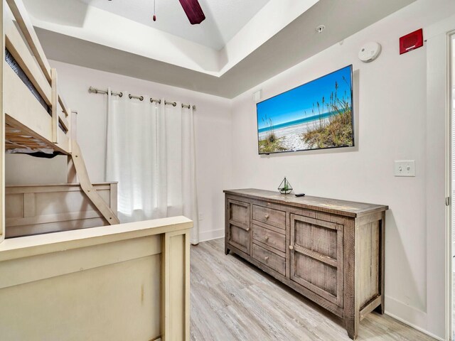 interior space with hardwood / wood-style floors and ceiling fan