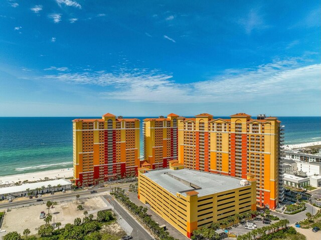 drone / aerial view featuring a view of the beach and a water view