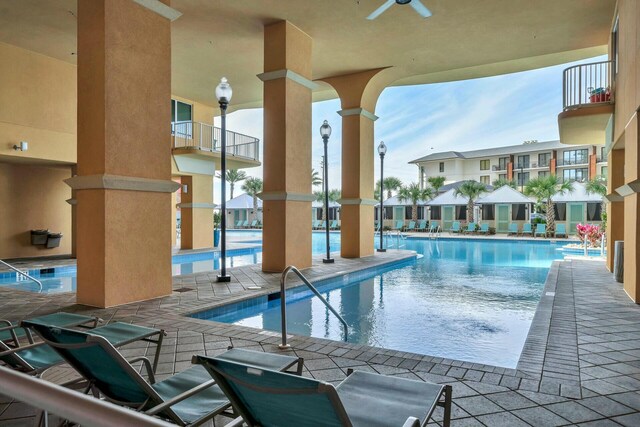 view of pool featuring ceiling fan and a patio area